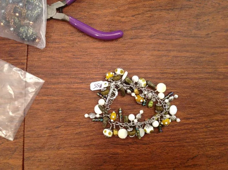 Olive Green Dangle Bracelet, original archive photograph of handmade glasswork by Ann Wierbinski