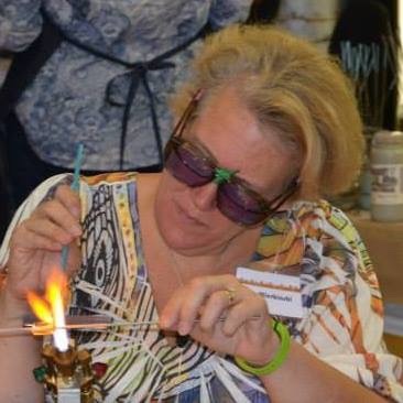 Ann Wierbinski working at a lampwork torch
